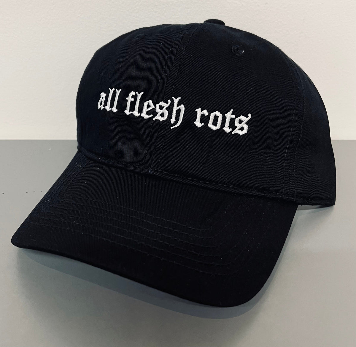 all flesh rots - Embroidered Dad Hat