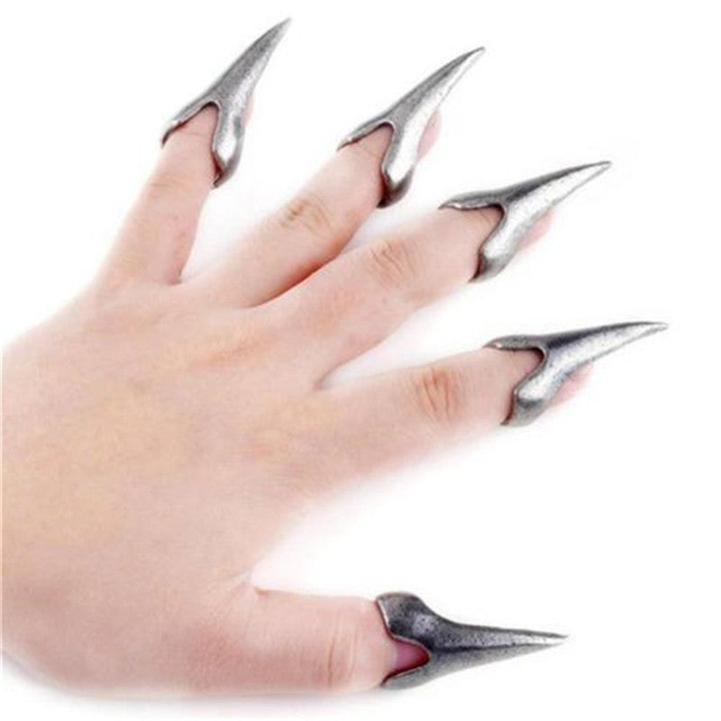 Hand adorned with a dark, gothic 12-piece claw ring set, showcasing dramatic spikes and intricate detailing.