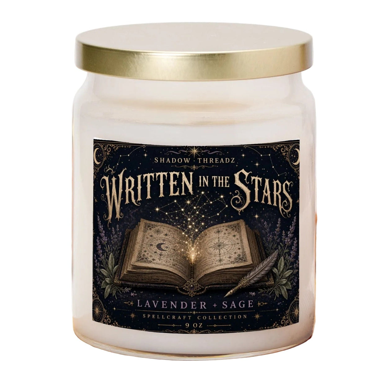 A 9 oz glass jar candle with a gold lid and a dark navy label reading 'Written in the Stars' and 'Lavender & Sage' by Shadow Threadz, styled on a wooden cutting board with a plaid cloth and small pumpkins in the background.