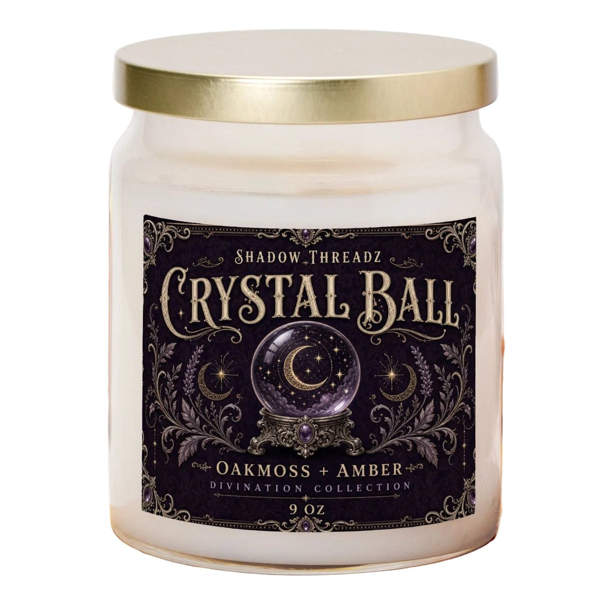 A 9 oz glass jar candle with a gold lid and a dark label reading 'Crystal Ball' by Shadow Threadz, styled on a wooden board with pumpkins and an orange plaid cloth in the background.