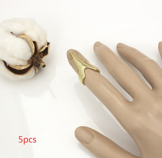 Gothic claw ring set on a hand, featuring stylish spikes and dramatic design, perfect for edgy fashion looks.