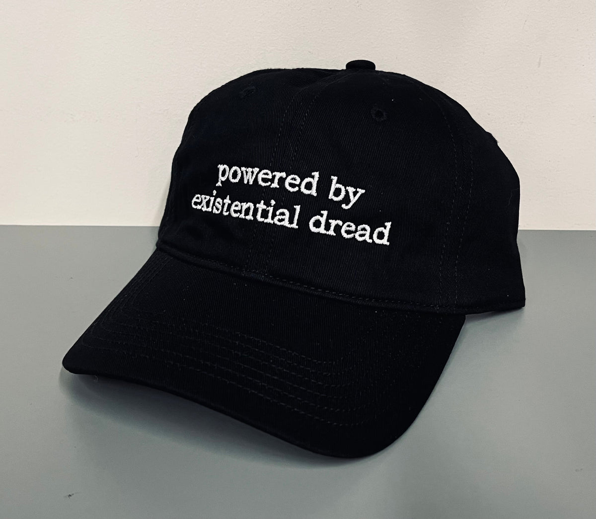 powered by existential dread - Embroidered Dad Hat
